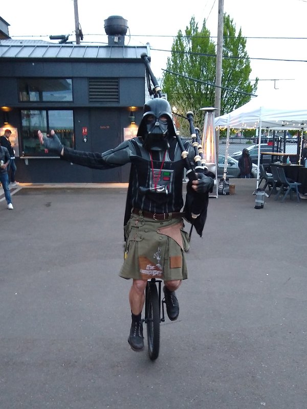 Darth Vader with bagpipes on a unicycle